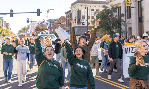 Maneater students at Homecoming parade.