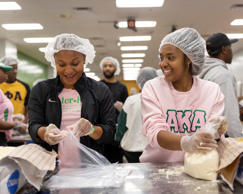 Students volunteering at event.