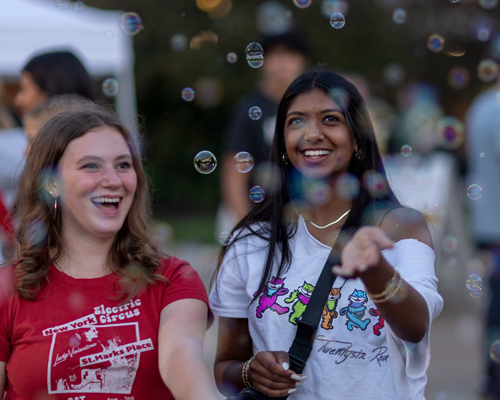 Students at event with bubbles.