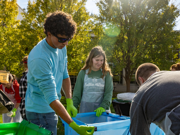 student participating in sustain mizzou event outdoor