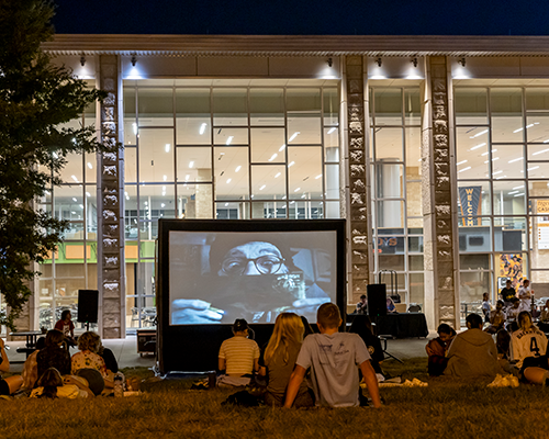 Students watching an outdoor movie.