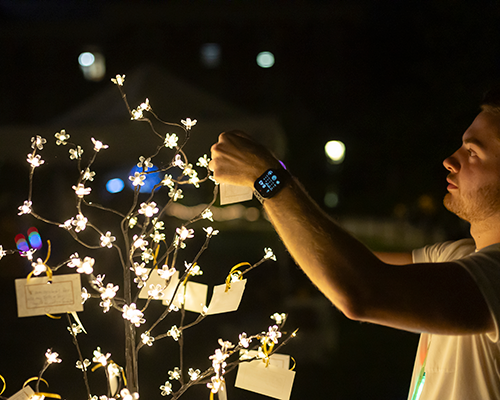 Student at CAPB Illumination event.